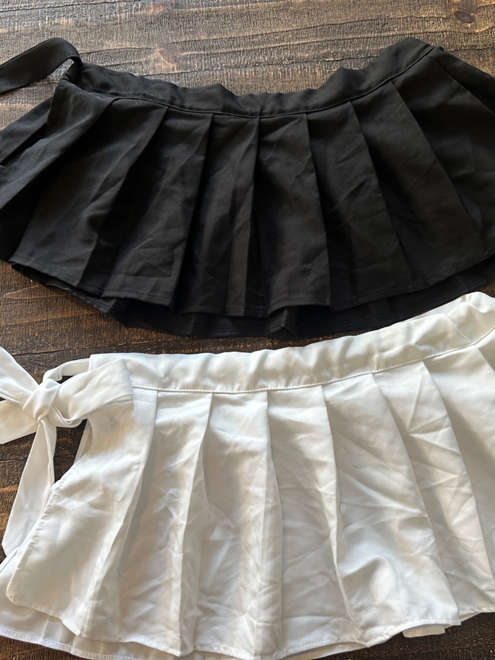 Pleated Mini Skirt Duo — Black and White Tie-Waist Minis